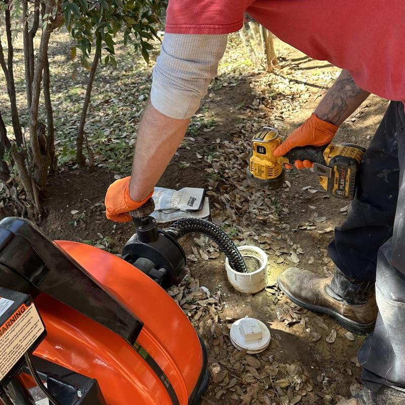 Main drain cleaning with power auger and drill
