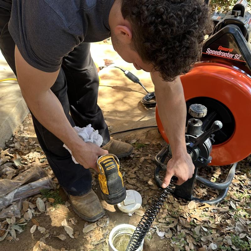 Main drain cleaning with electric drain snake machine