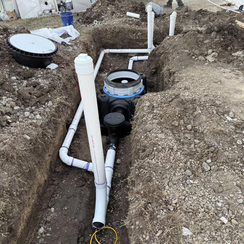 Grease trap installation with connected PVC piping