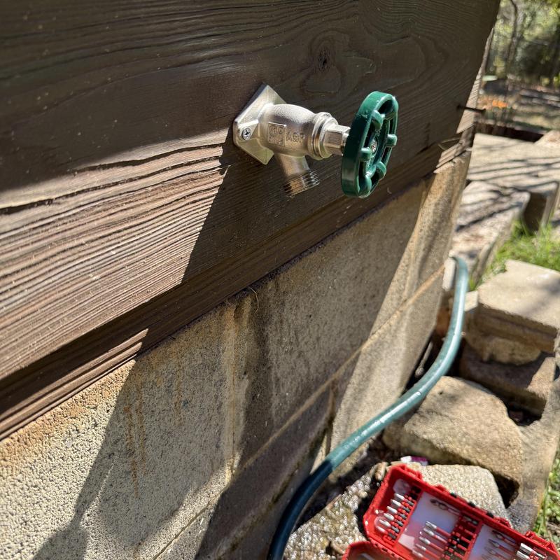 Frost proof hose bib with green valve handle installation