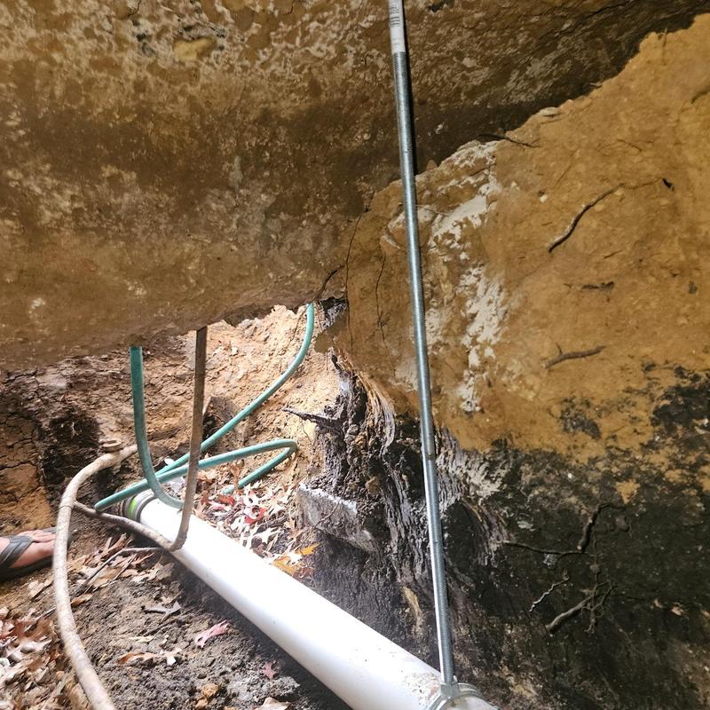 Horizontal sewer line replacement under home trench