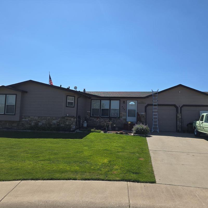 Shingle roof with hail and wind damage, ladder set up Shingle roof with hail and wind damage, ladder set up