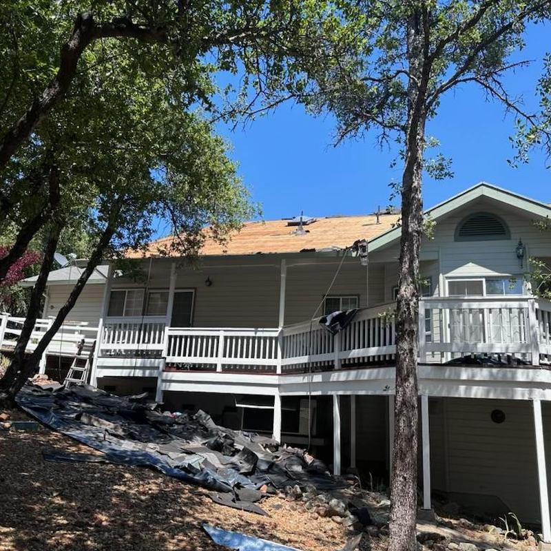 Asphalt roof replacement on Sonora home with dry rock repair