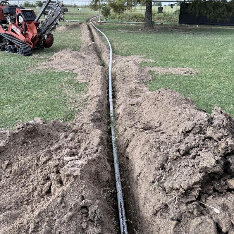 2-inch PVC water line trench installation in yard