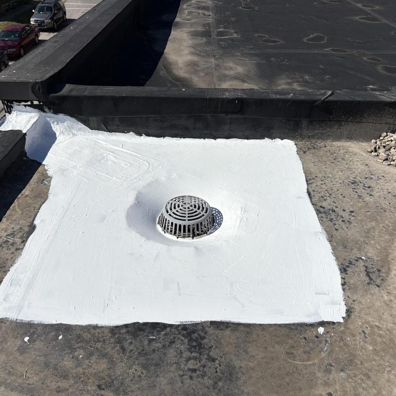 EPDM roof drain sealed with white coating