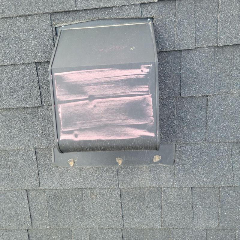 Roof vent with hail damage on asphalt shingles Roof vent with hail damage on asphalt shingles