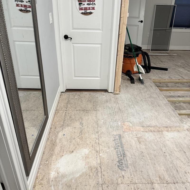 Subfloor replacement and hardwood floor prep in hallway