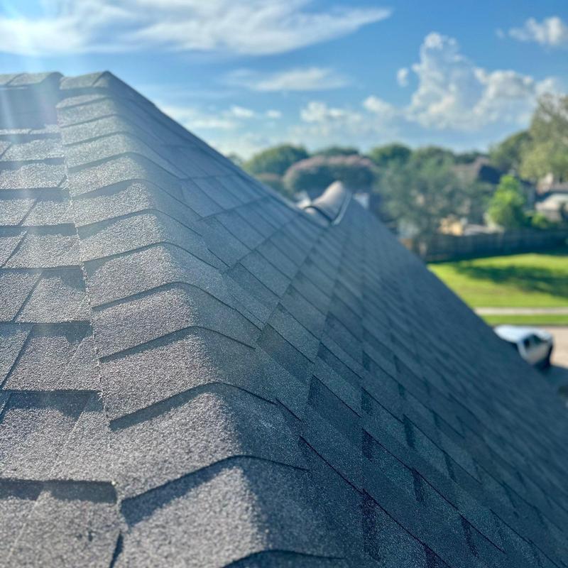 Tamko Titan XT Weathered Wood roof shingles in sun Tamko Titan XT Weathered Wood roof shingles in sun