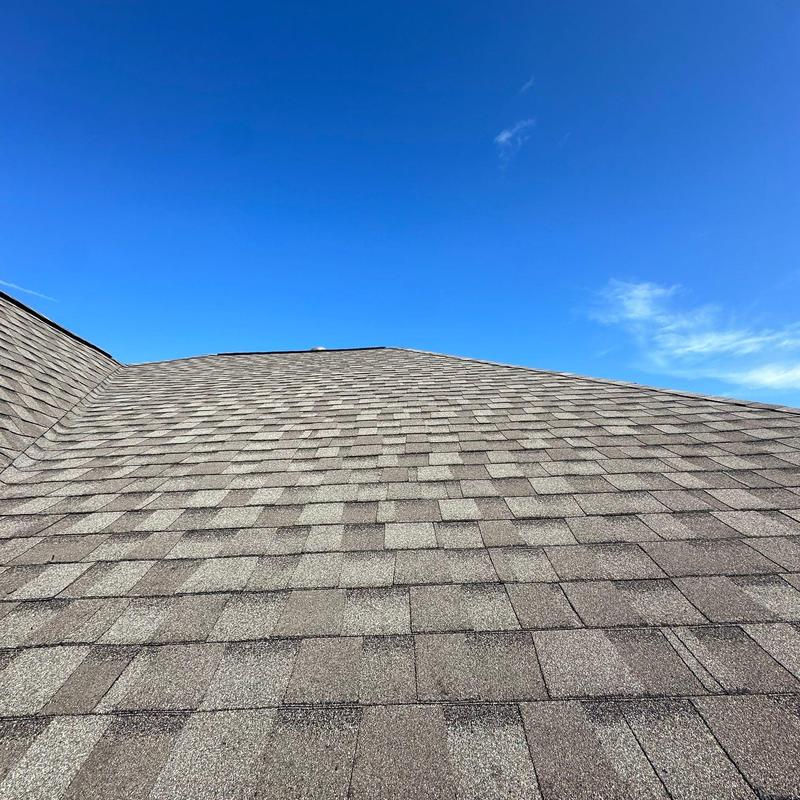 Tamko Titan XT Weathered Wood roof shingles under clear sky Tamko Titan XT Weathered Wood roof shingles under clear sky