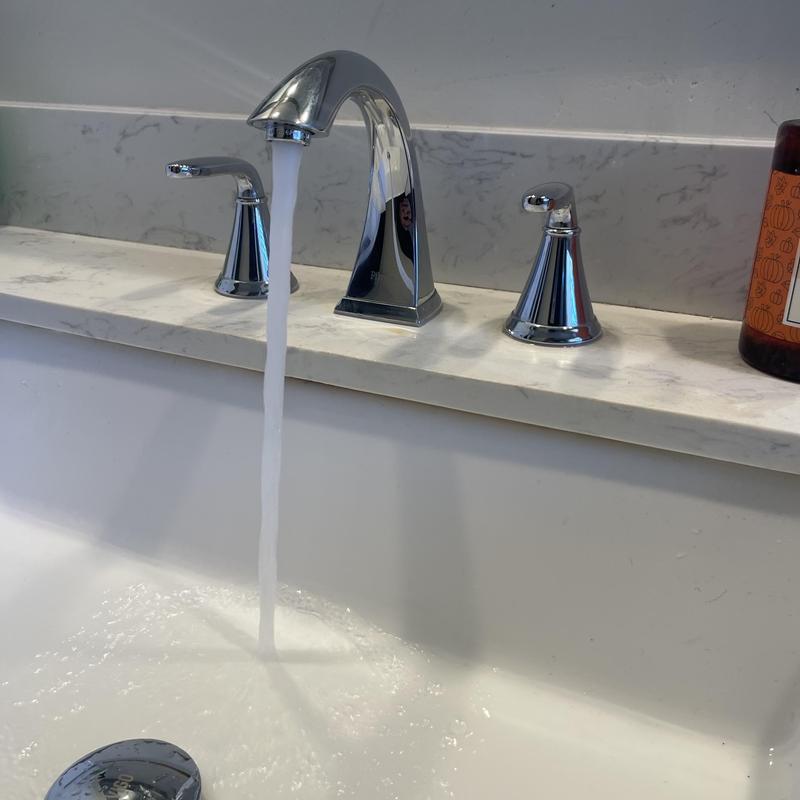 Pfister widespread chrome faucet with running water