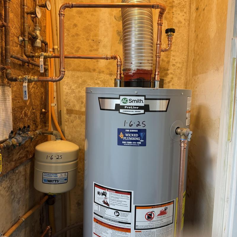 Water heater and copper piping installation in utility room Water heater and copper piping installation in utility room