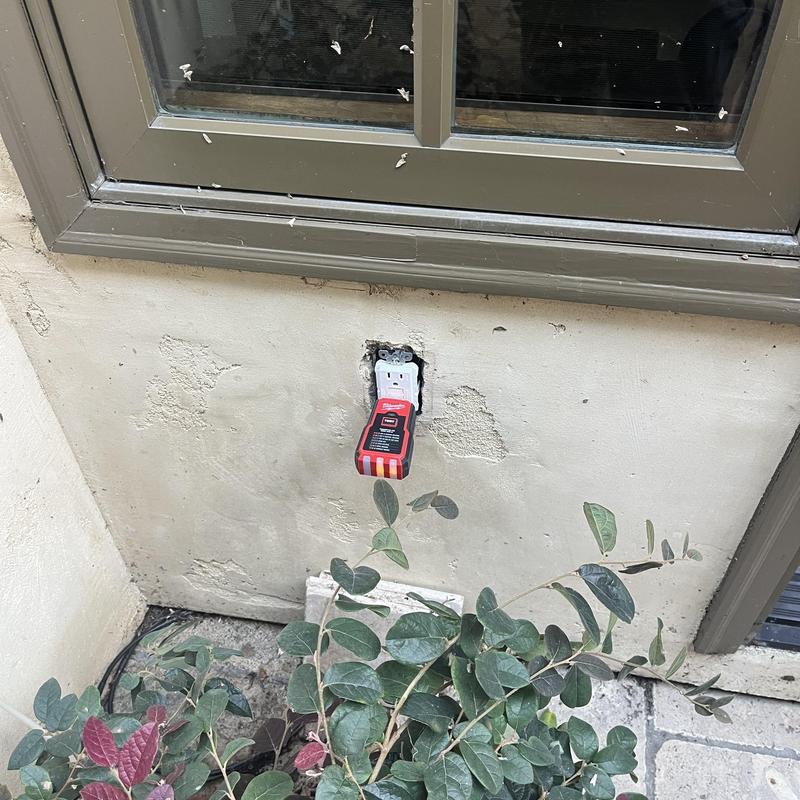 Exterior GFCI electrical receptacle with tester attached