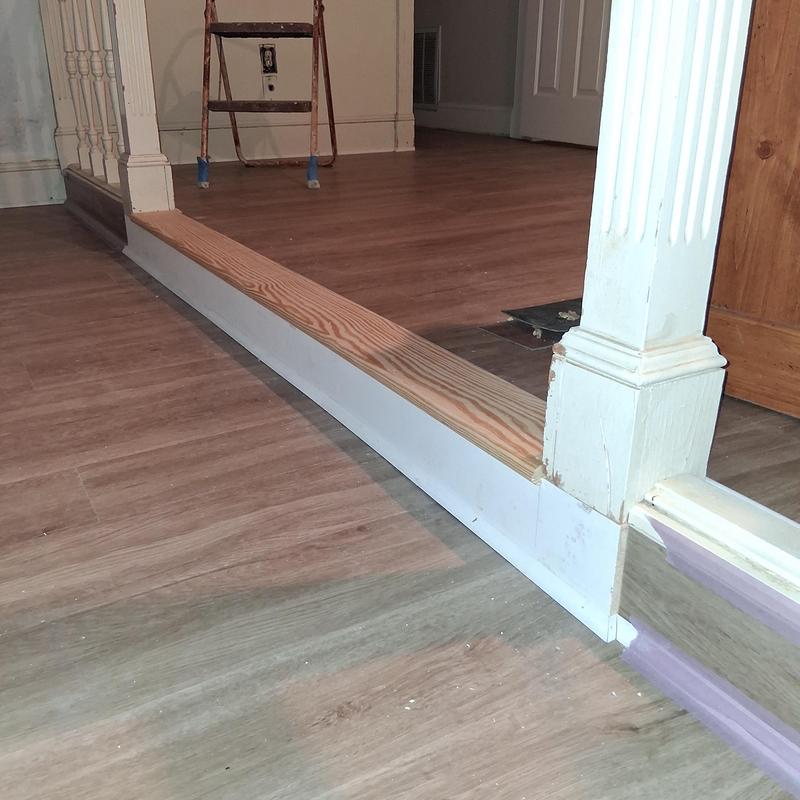 Wood landing tread with shoe and quarter round molding installation