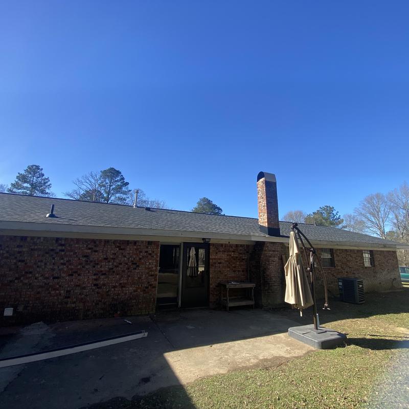 Architect shingle roof system on brick home exterior