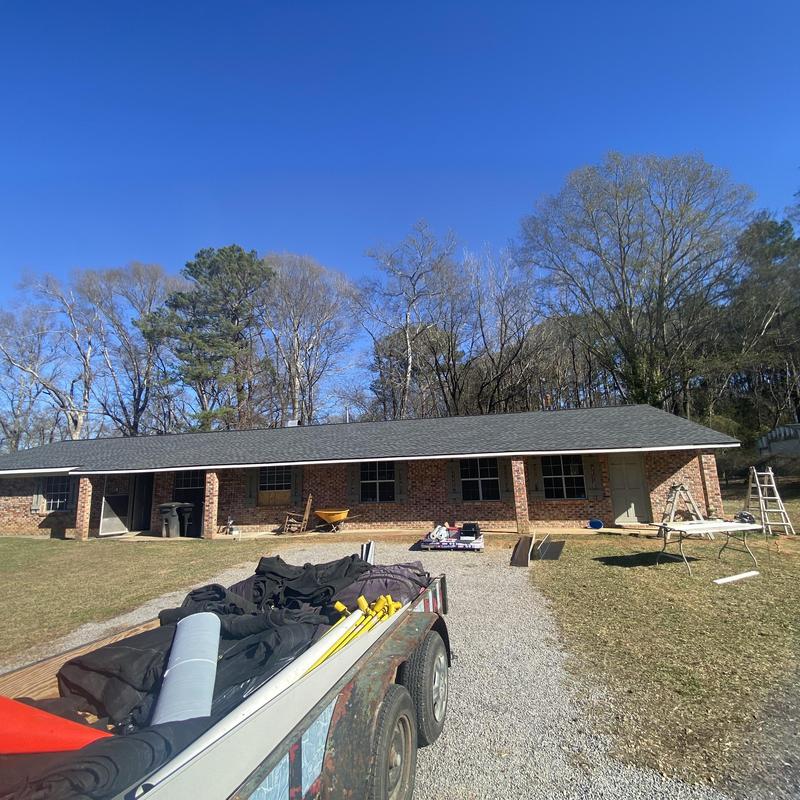 Architect asphalt shingle roof system on brick house
