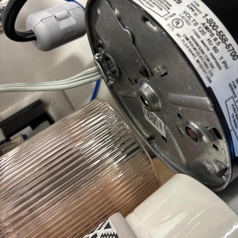 Garbage disposal motor and wiring close-up view