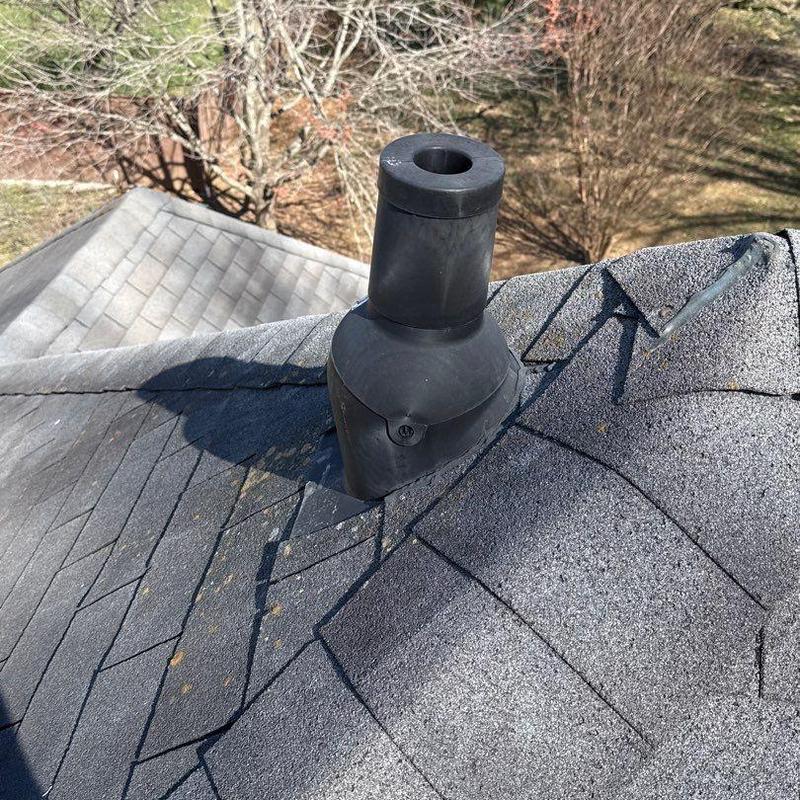 Roof vent flashing with shingle hail damage
