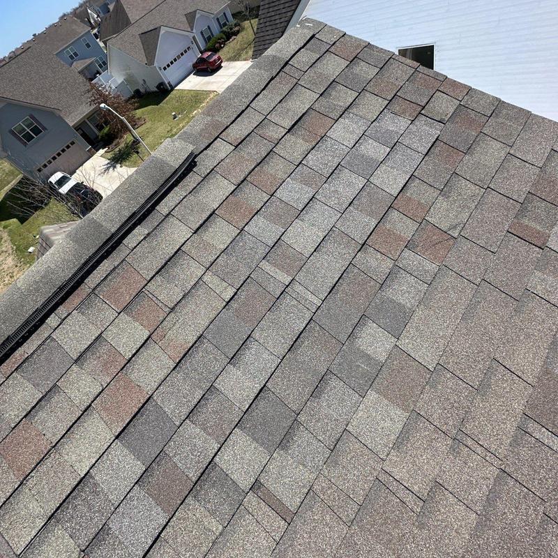Asphalt shingle roof with hail damage inspection