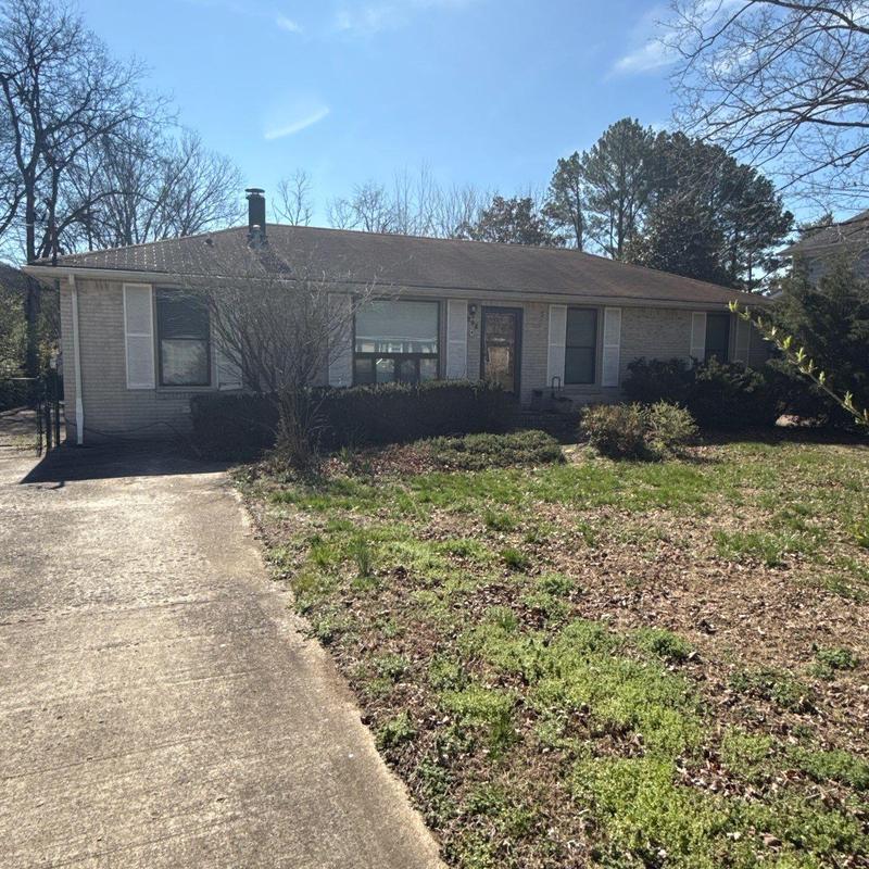 Roof shingles with hail damage on suburban house