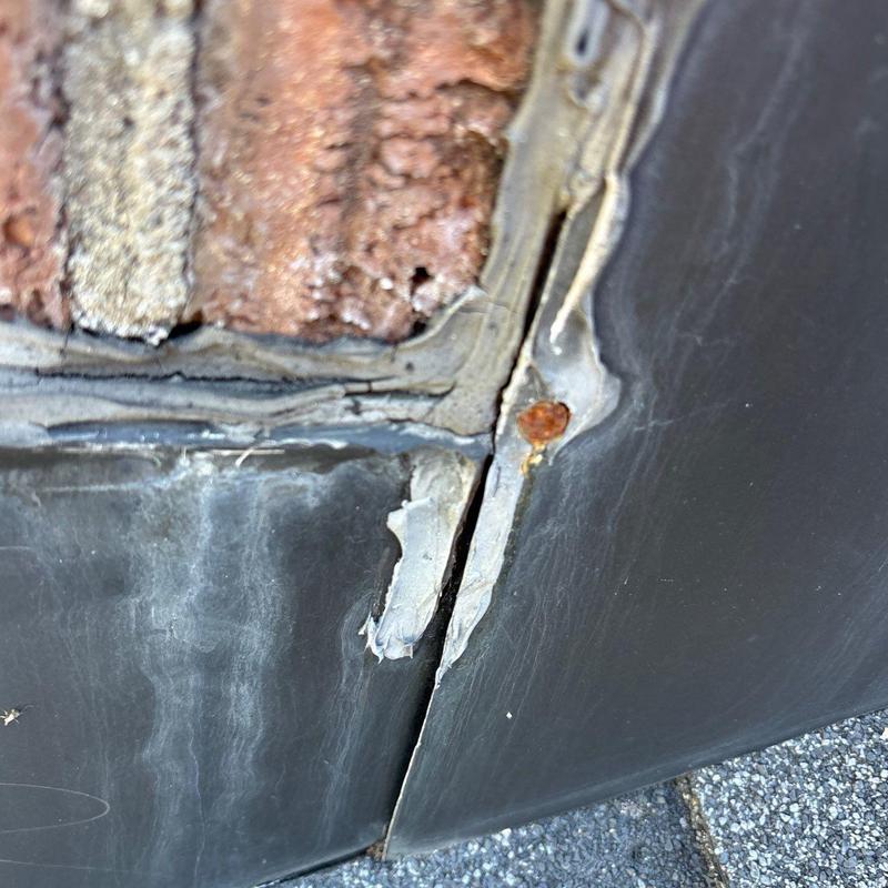 Flashing seals on roof with rust and cracks