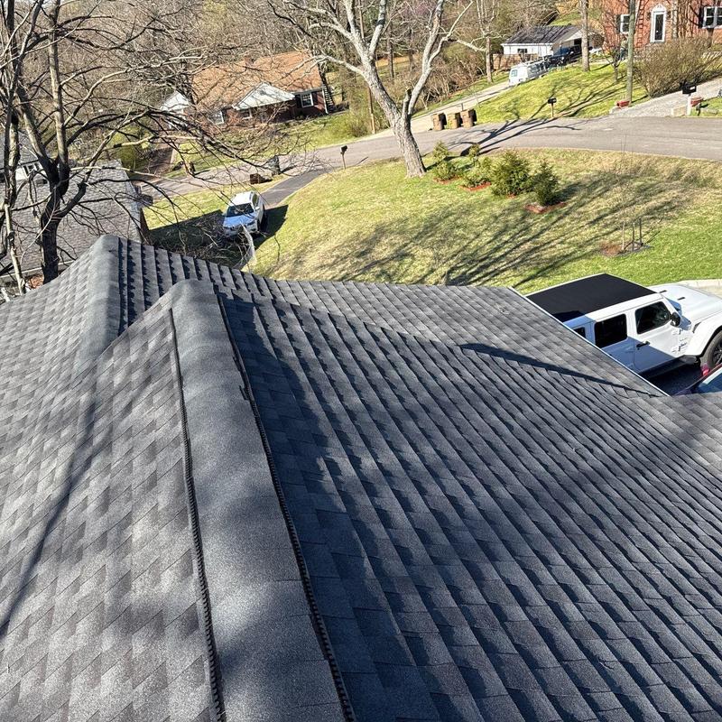 Asphalt shingle roof with ridge vent and ventilation inspection