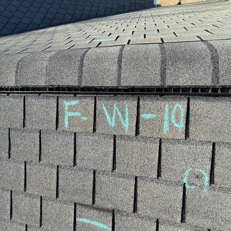 Asphalt shingle roof with chalk marking for inspection