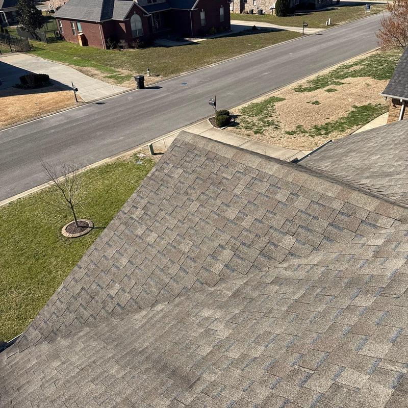 Asphalt shingle roof with visible hail damage