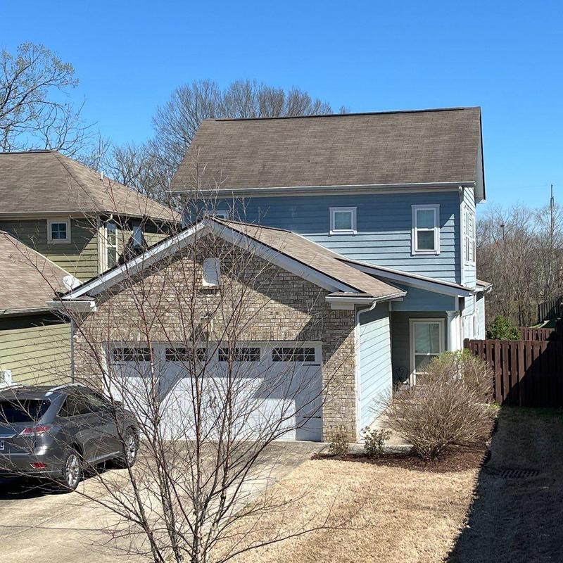 Asphalt shingle roof with hail damage inspection