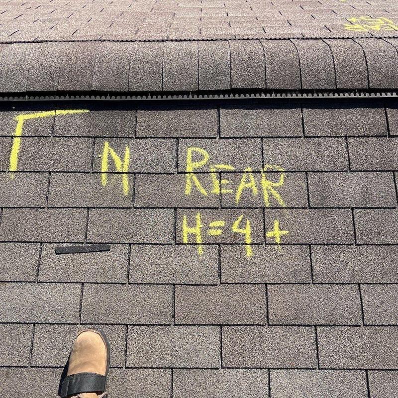 Asphalt shingles with hail damage markings