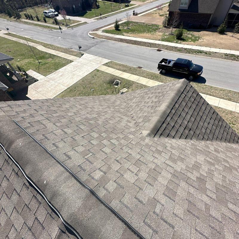 Asphalt shingle roof with hail damage inspection