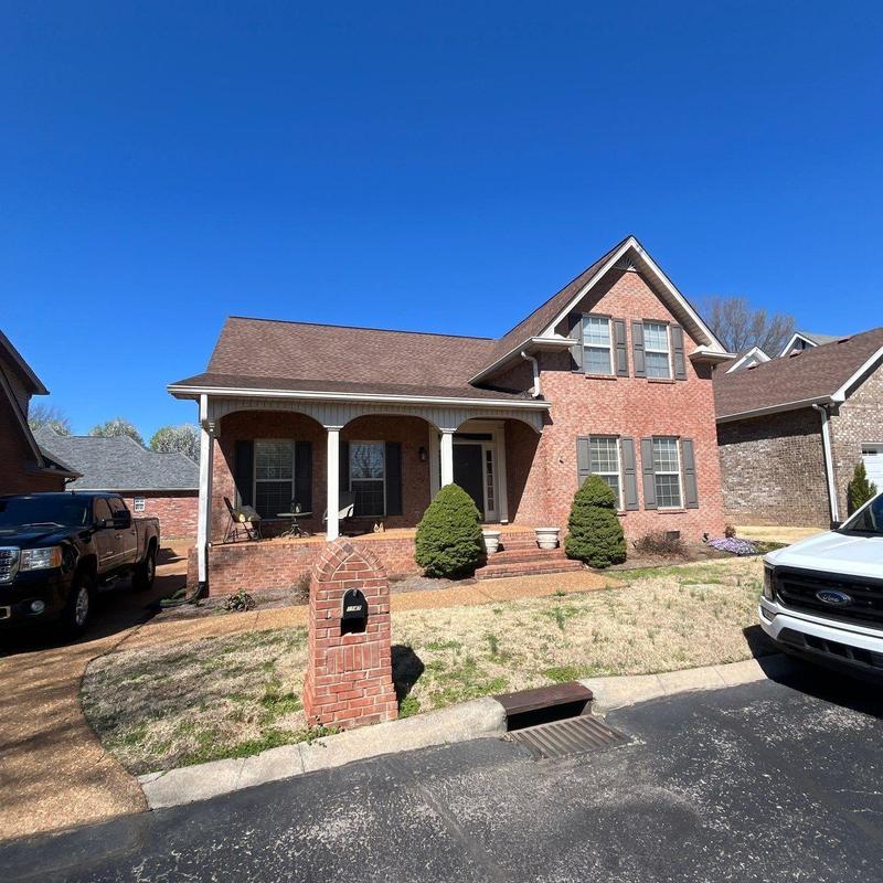 Asphalt shingle roof with hail damage inspection