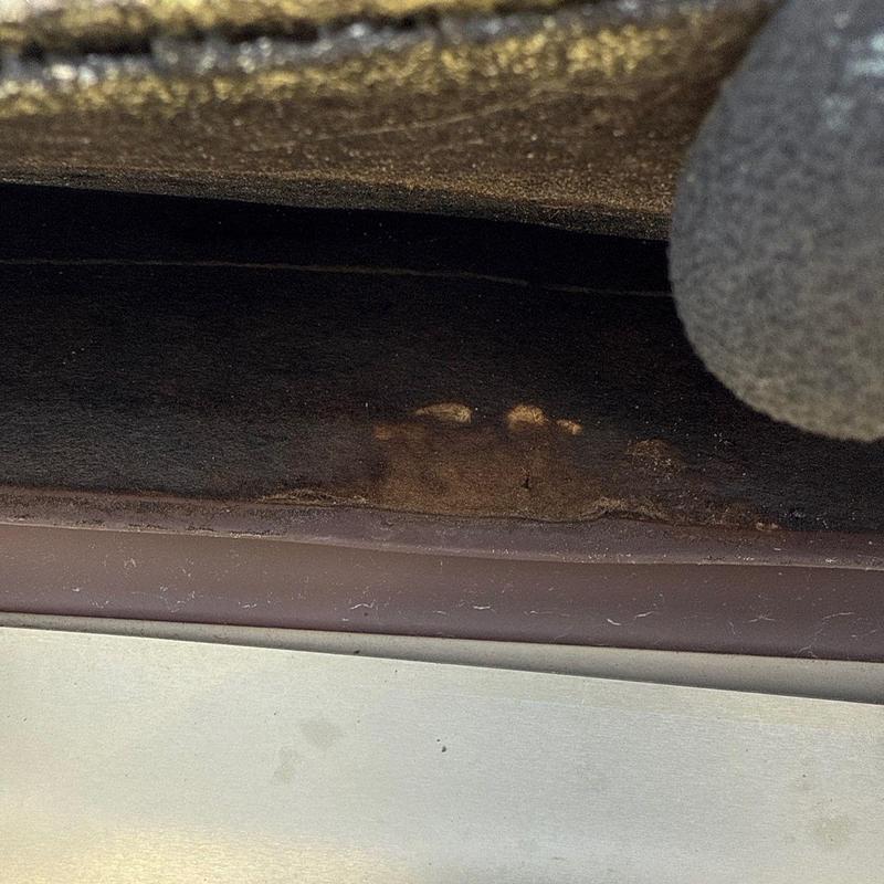 Asphalt shingle roof edge with hail damage close-up