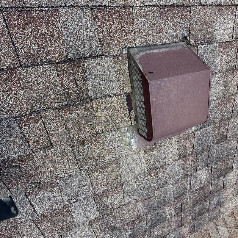 Asphalt shingle roof with metal vent cover