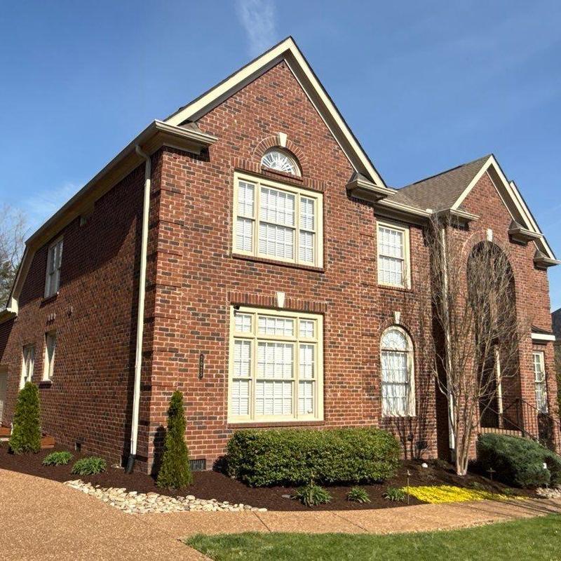 Shingle roof hail damage inspection on brick house