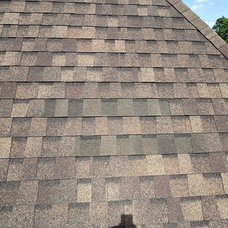 Architectural asphalt shingles with hail damage on roof