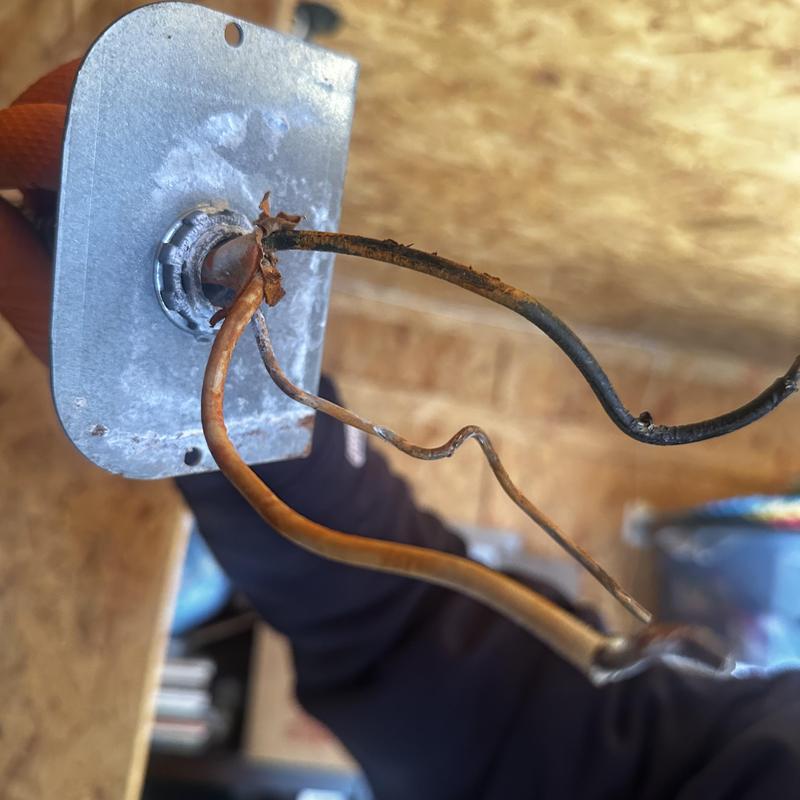 Thermostat mounting plate with corroded wires