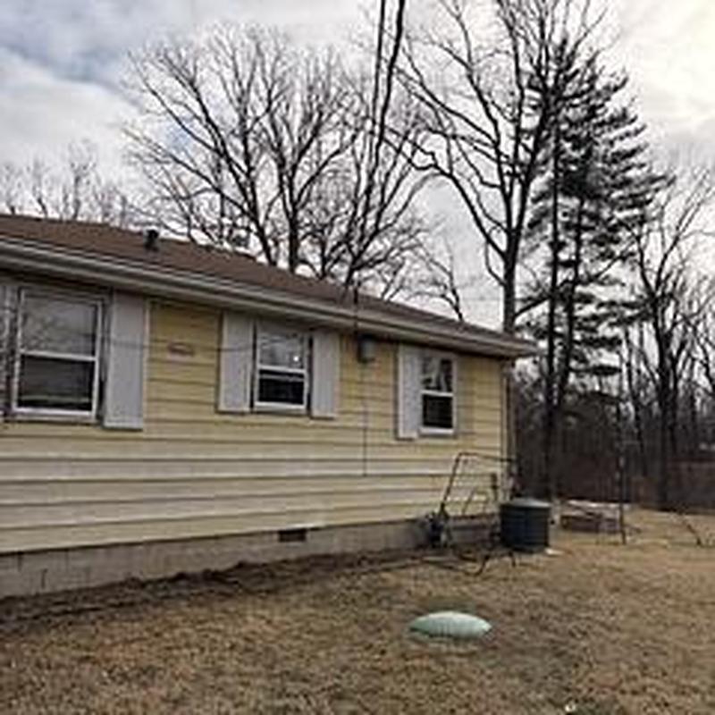 Sewer line excavation and new pipe installation outside house