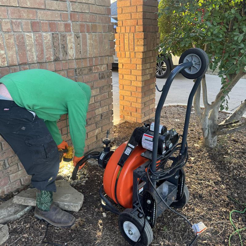 Main sewer line cleaning with electric auger tool