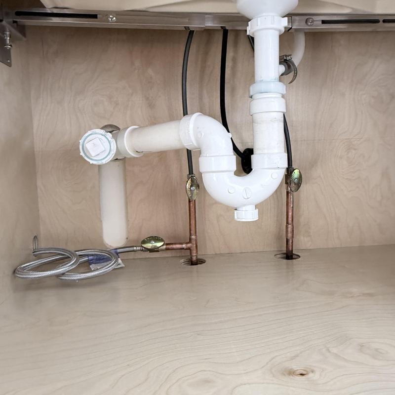 Dishwasher water lines and drain pipe under sink installation