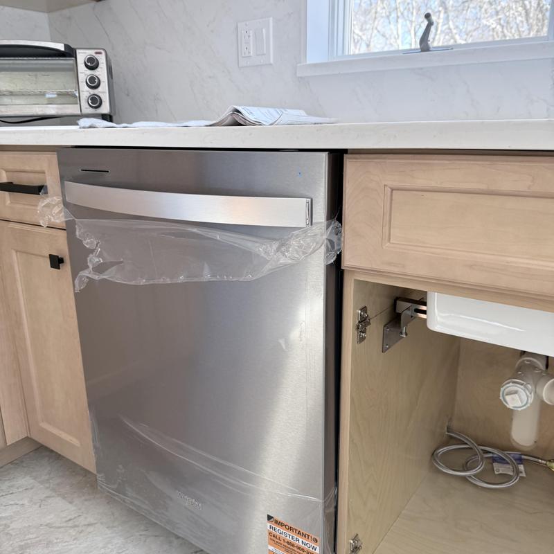 Dishwasher installation in kitchen cabinet space