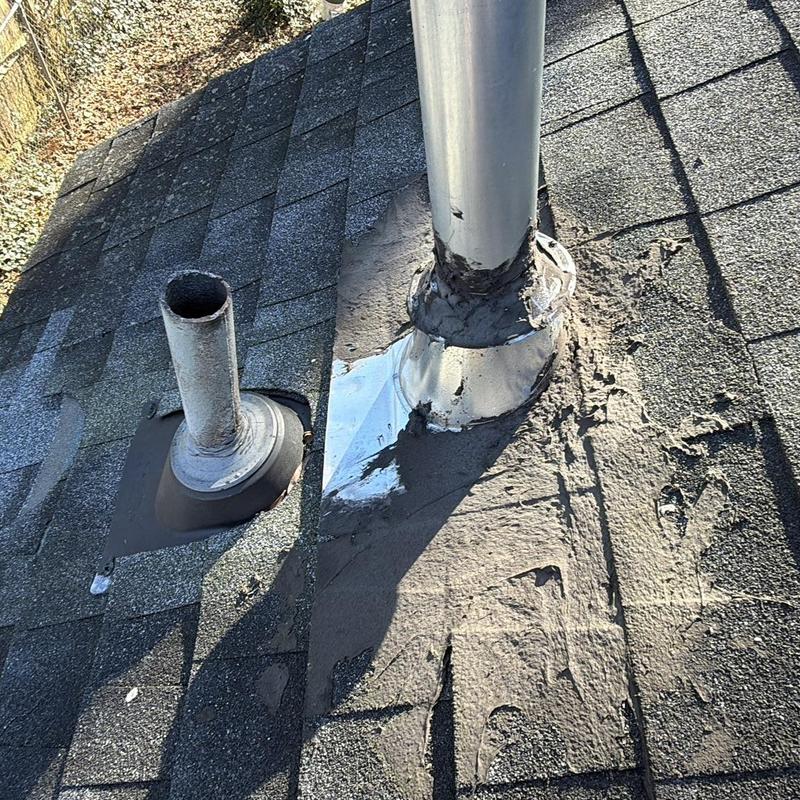Water heater vent pipe with new shingles and boots
