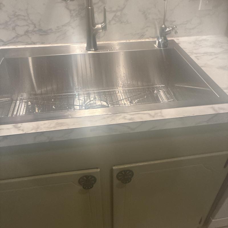 Kitchen sink with new faucet and drain connections