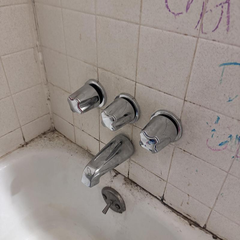 Three-handle shower valve with new chrome knobs