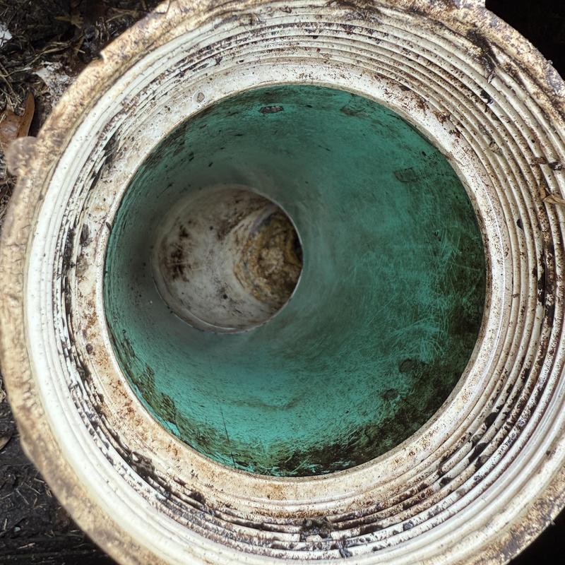 Grey water pipe interior after clog clearance