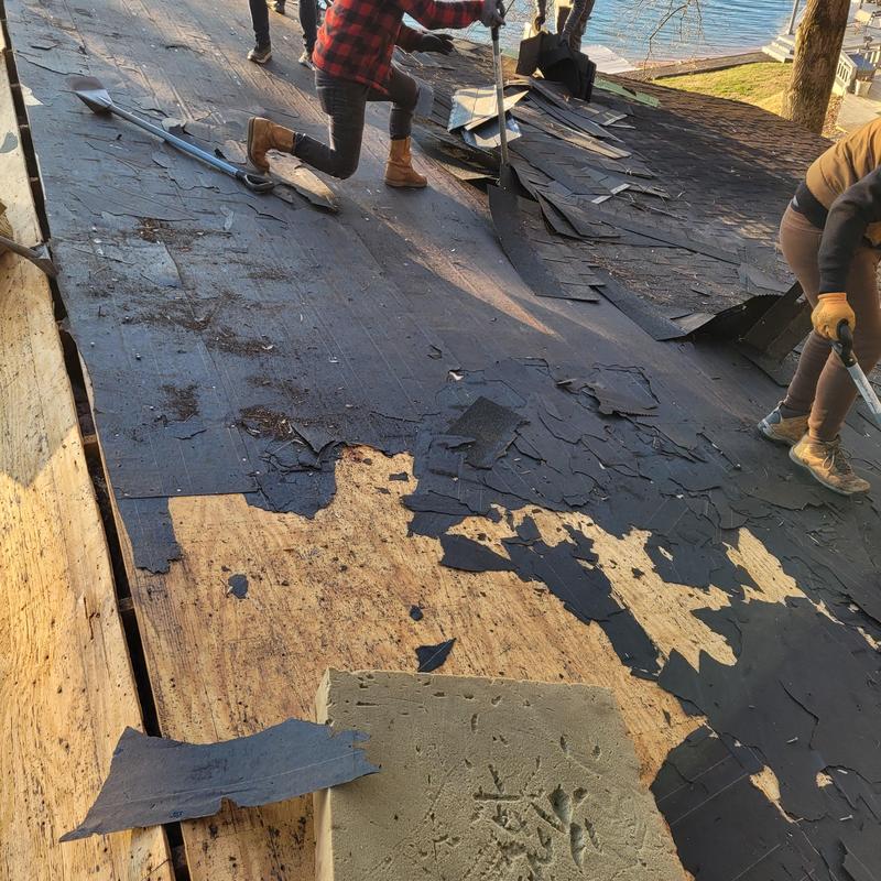 Roof decking with old felt and shingles removal near lake