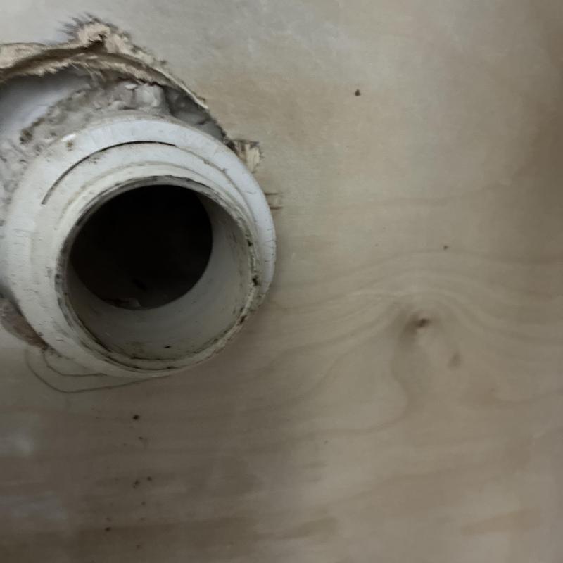 Sink drain pipe with surrounding wall damage