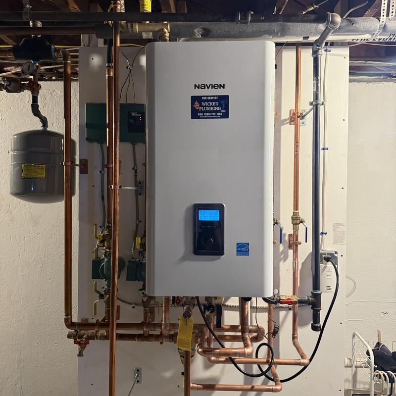 Navien tankless boiler with copper piping in basement