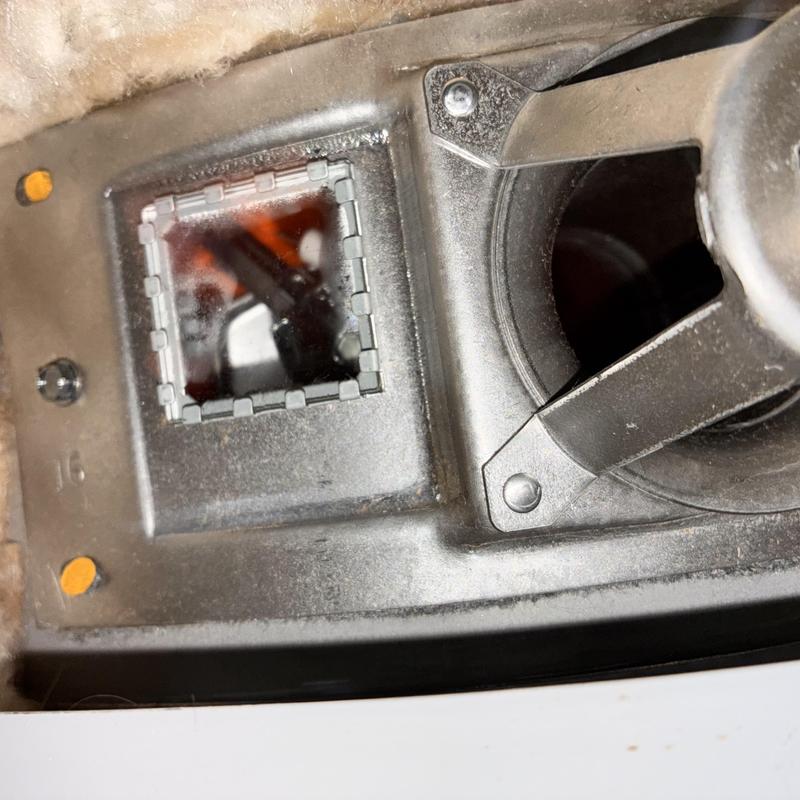 AO Smith water heater burner with visible flame