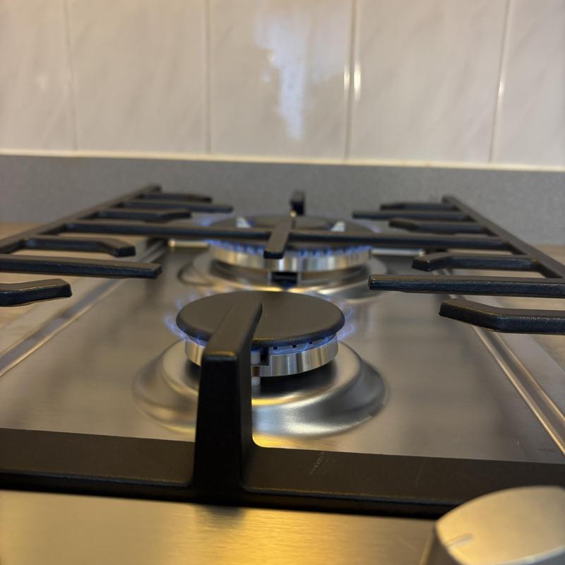 Gas shut-off valve replacement on residential stove burner Gas shut-off valve replacement on residential stove burner