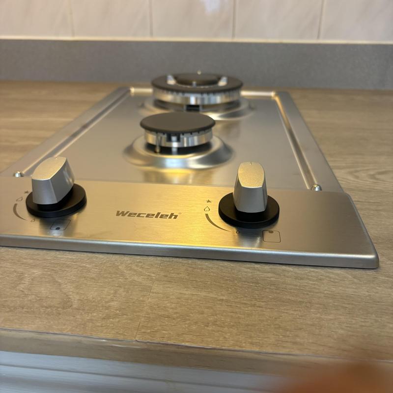 Gas cooktop with control knobs installed on countertop Gas cooktop with control knobs installed on countertop